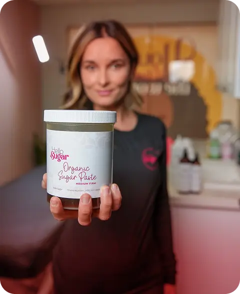 Hello Sugar esthetician with product